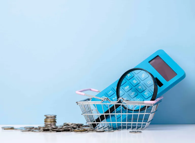 50881542_blue-plastic-calculator-and-magnifier-budget-analysis-scaled.jpg