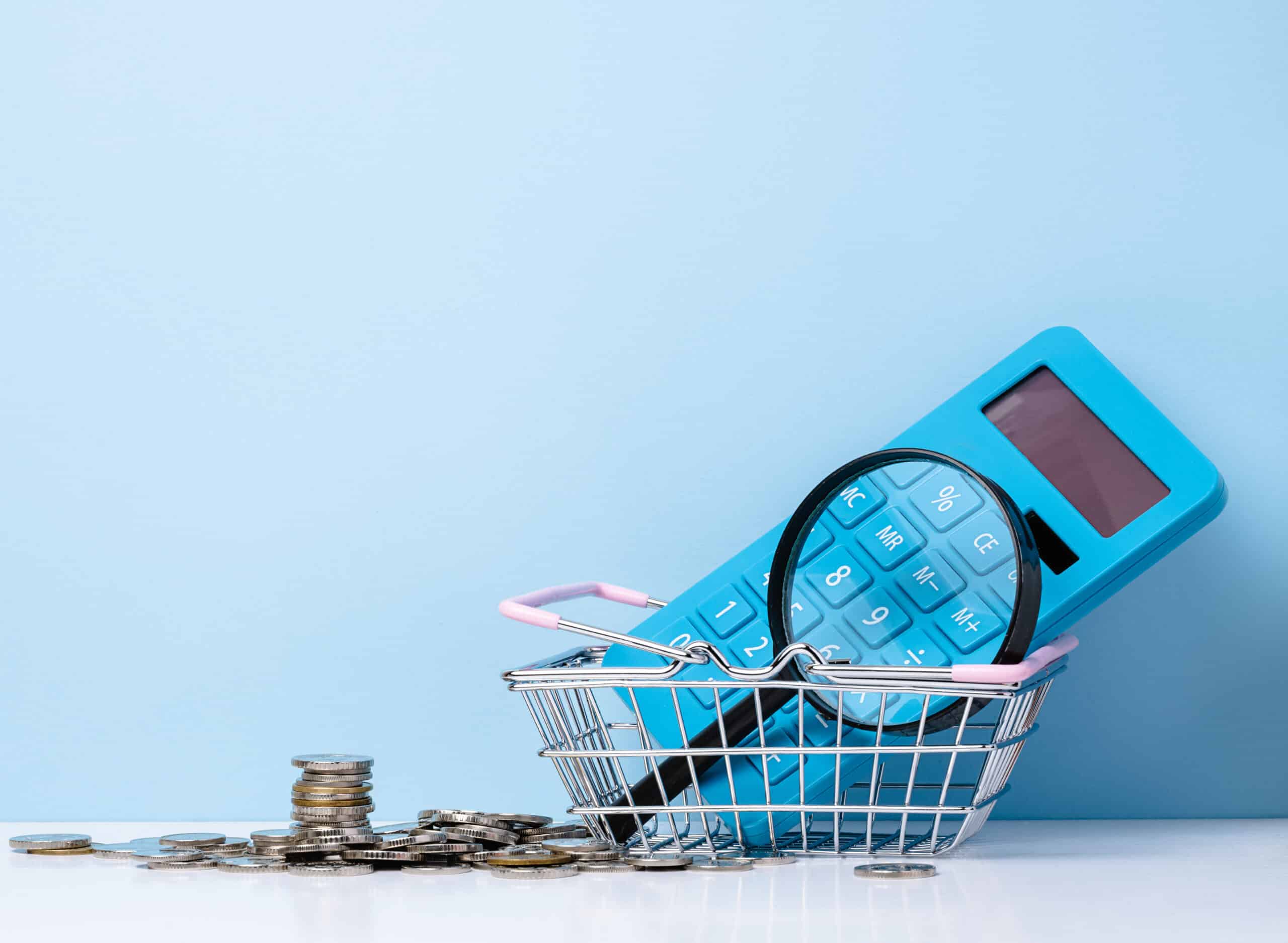 50881542_blue-plastic-calculator-and-magnifier-budget-analysis-scaled.jpg